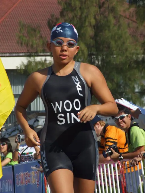 Jina in cap and goggles running out of the swim leg at the 2007 SEA Games triathlon